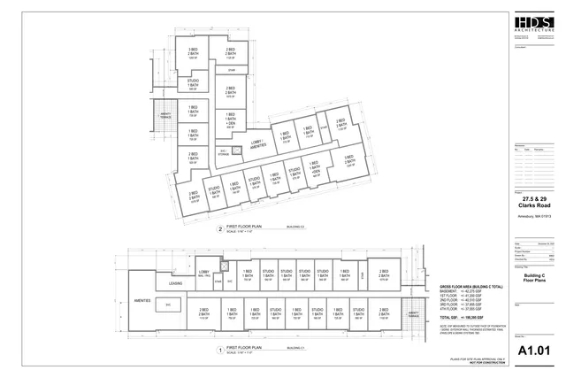 Architectural floor plan sheet showing the first-floor layouts for Buildings C1 and C2, with apartment unit types, lobby/amenity spaces, leasing, stair, and service areas labeled. The title block identifies it as Building C Floor Plans for 27.5 & 29 Clarks Road in Amesbury.