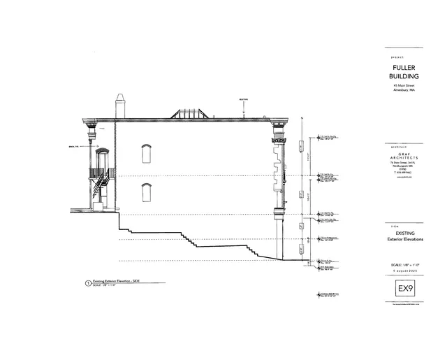 Black-and-white architectural elevation drawing of the existing side exterior of the Fuller Building at 45 Main Street in Amesbury, showing façade height, roofline, windows, stairs, and grade changes. The sheet is labeled as an existing exterior elevation.