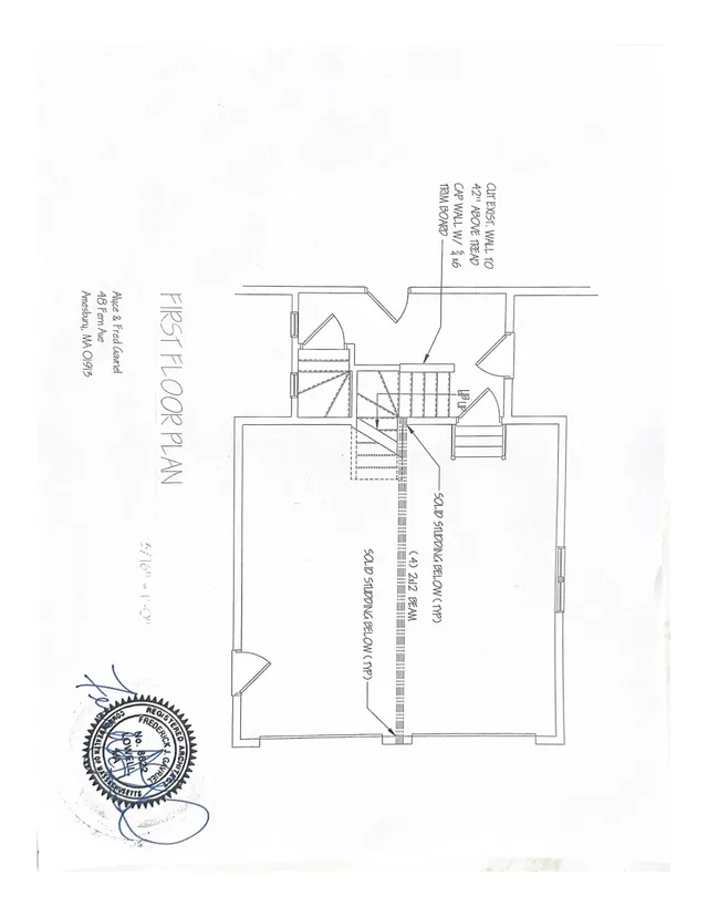 First floor plan showing interior room layout, stair locations, and a note calling out cutting an existing wall to insert a new beam/trim board. The sheet includes the project title and an architect's stamp.