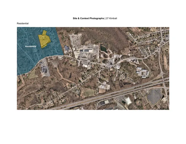 An aerial satellite image of the area around 27 Kimball Road, with the project site outlined in yellow and the surrounding residential area shaded in blue. Nearby roads, buildings, and wooded areas are visible in context.