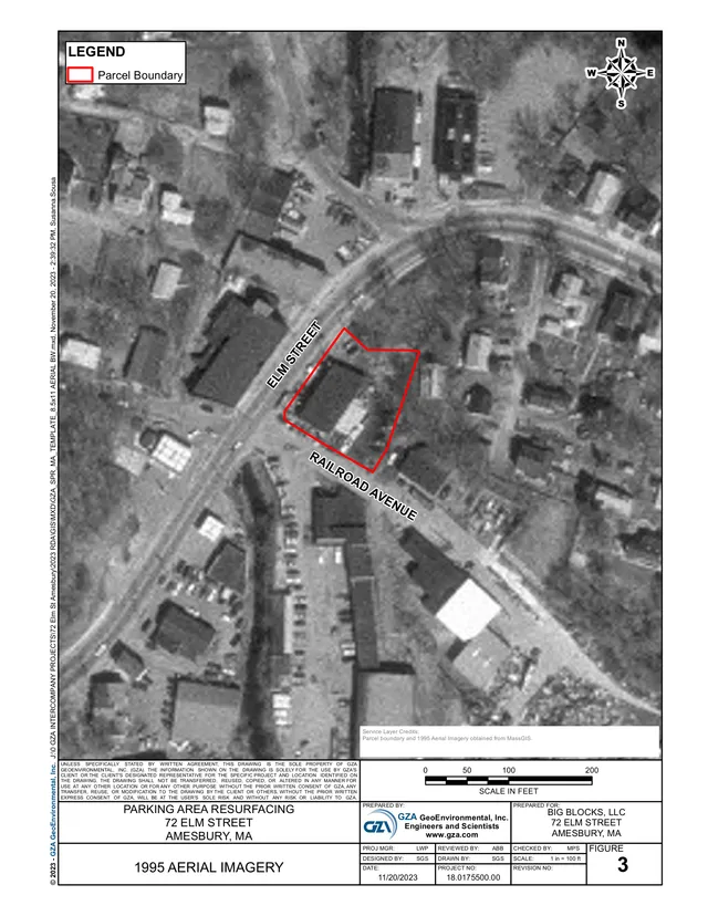 Grayscale aerial imagery showing the 72 Elm Street parcel outlined in red, located between Elm Street and Railroad Avenue in Amesbury. The sheet includes a north arrow, scale bar, and surrounding neighborhood context.