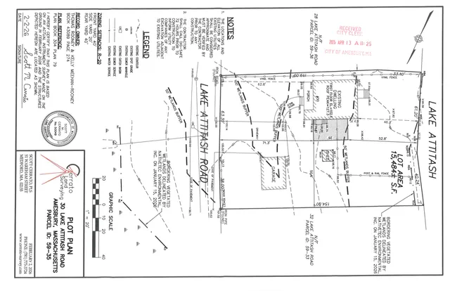 Black-and-white plot plan for 30 Lake Attitash Road showing the existing dwelling, garage, driveway, lot boundaries, wetlands buffers, and proposed site features on the Amesbury parcel. The sheet includes survey notes, zoning setbacks, and adjoining parcel references.