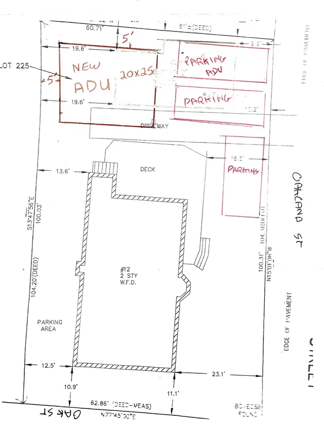 Site plan showing the existing house footprint, proposed new ADU area, and several marked parking spaces/parking areas on the lot at 12 Oak Street. Handwritten red annotations outline the proposed ADU and parking layout, with property lines, setbacks, driveway, and deck also shown.