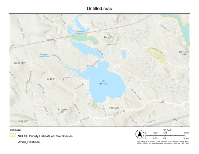 A regional map centered on Lake Attitash and surrounding roads in Amesbury, Massachusetts, with yellow hatched overlays marking NHESP Priority Habitats of Rare Species. The map includes a north arrow, scale bar, and basemap labels for nearby roads, hills, and water bodies.