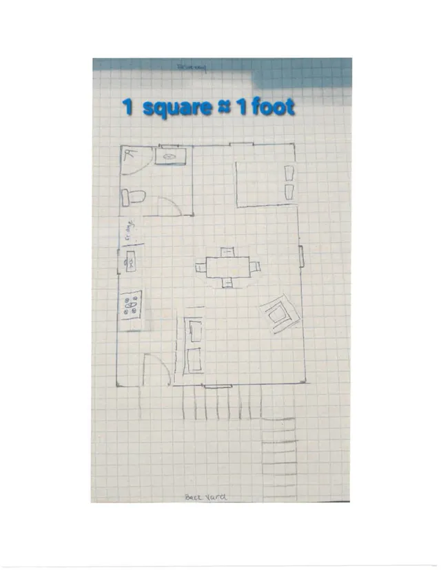 Hand-drawn floor plan sketch on graph paper showing a residential layout with rooms, doors, furniture placement, and a labeled back yard area.