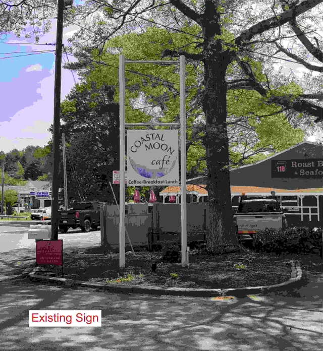 Street-level photo of an existing pole-mounted sign for "Coastal Moon Cafe" in front of the business, with trees and the parking lot visible around it. The image is labeled "Existing Sign" and shows the sign frame/poles and hanging method.