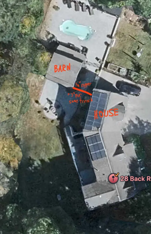 Annotated aerial view of the property at 28 Back River Rd showing the house, barn, driveway, and pool, with a marked trench route labeled for copper and PVC utility lines between the barn and house.