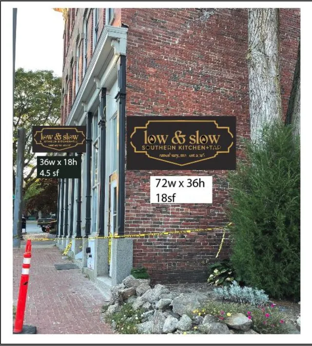 Photo mockup of the building facade showing proposed "Low & Slow" signage mounted on the brick exterior, with sign dimensions labeled for two different sign locations. The view looks along the sidewalk past the storefront toward the street.