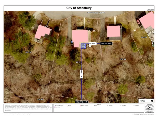 A parcel map over aerial imagery of the Pinewood Road area in Amesbury, showing parcel boundaries, building footprints, roads, and a highlighted property line measurement near 10 Pinewood Rd. The map includes nearby house footprints and lot labels, with the site outlined in blue.