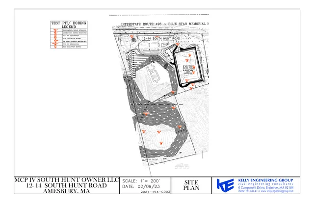 Civil site plan for 12–14 South Hunt Road in Amesbury, MA, showing the property boundary, existing building footprint, contour lines, test pit/boring locations, and nearby roadway context along Interstate 495/Blue Star Memorial Highway.