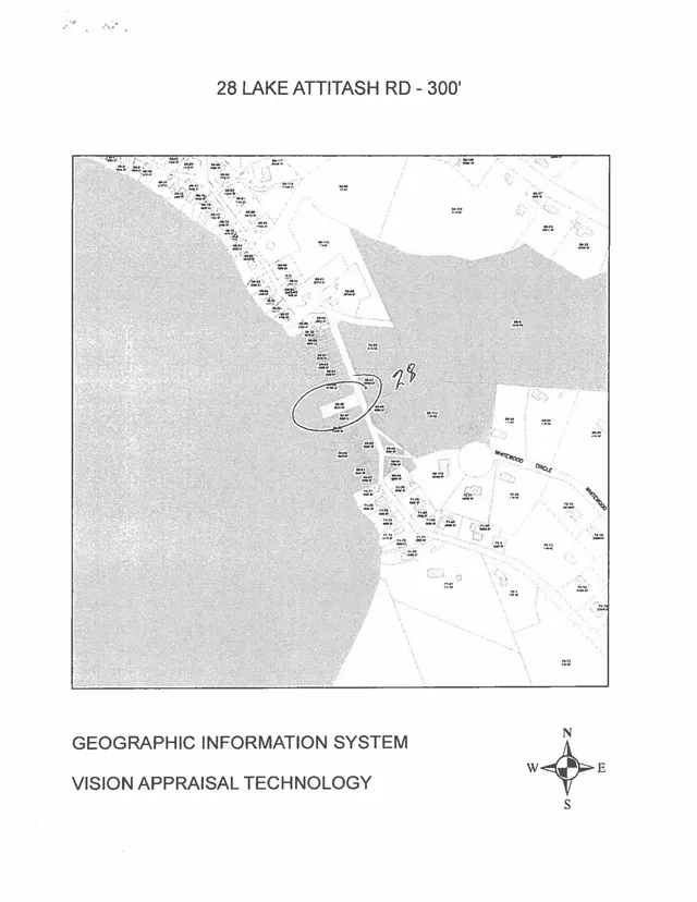 Grayscale GIS parcel map centered on 28 Lake Attitash Rd, with the subject property circled near the shoreline and surrounding lots labeled. A north arrow and the text "Geographic Information System / Vision Appraisal Technology" appear at the bottom.